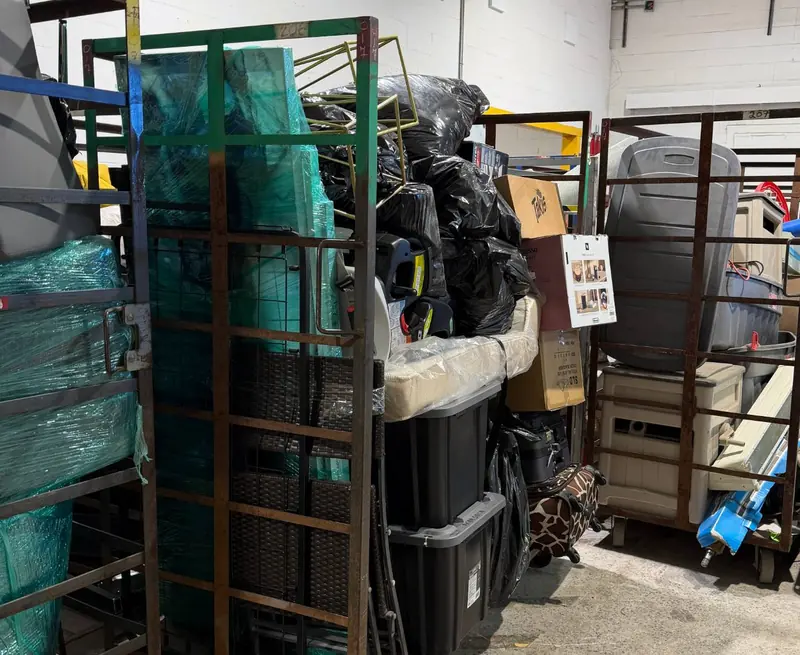 Wire carts filled with patio furniture, storage bins and boxes